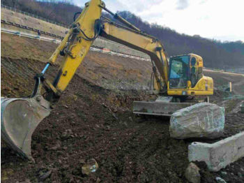 Pelle sur pneus KOMATSU PW180