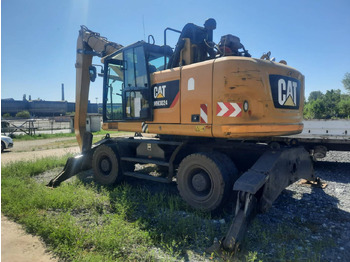 Pelle sur pneus CATERPILLAR MH3024