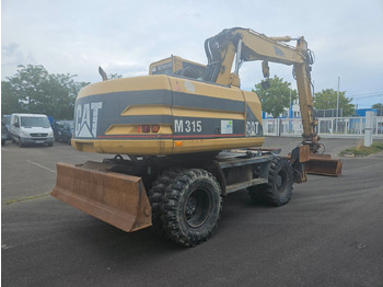 Pelle sur pneus CAT M315 Mobilbagger mit Pratzen und Schild: photos 3