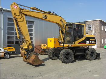 Pelle sur pneus CAT 312: photos 1