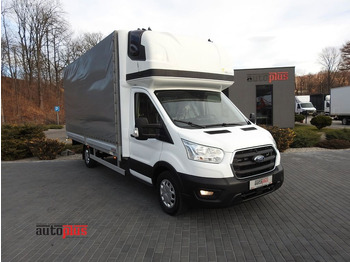 Véhicule utilitaire plateau baché FORD Transit