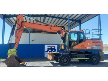 Pelle sur pneus DOOSAN DX210