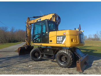 Pelle sur pneus CATERPILLAR M313D