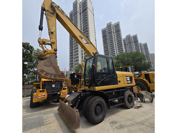 Pelle sur pneus CATERPILLAR M320