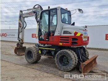 Pelle sur pneus 2015 Takeuchi TB295W: photos 3 Pelle sur pneus 2015 Takeuchi TB295W: photos 3
