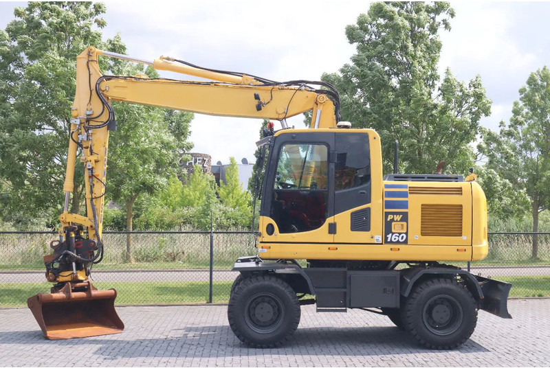 Komatsu PW 160-10 | ROTOTILT | NEW TIRES - Pelle sur pneus: photos 1 Komatsu PW 160-10 | ROTOTILT | NEW TIRES - Pelle sur pneus: photos 1
