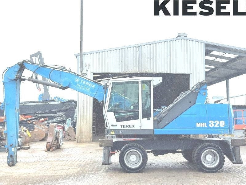 Fuchs MHL 320 D - Pelle de manutention: photos 1 Fuchs MHL 320 D - Pelle de manutention: photos 1
