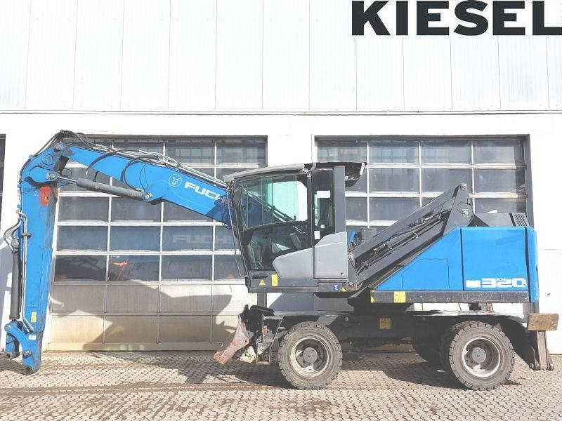 Fuchs MHL 320 F - Pelle de manutention: photos 1 Fuchs MHL 320 F - Pelle de manutention: photos 1