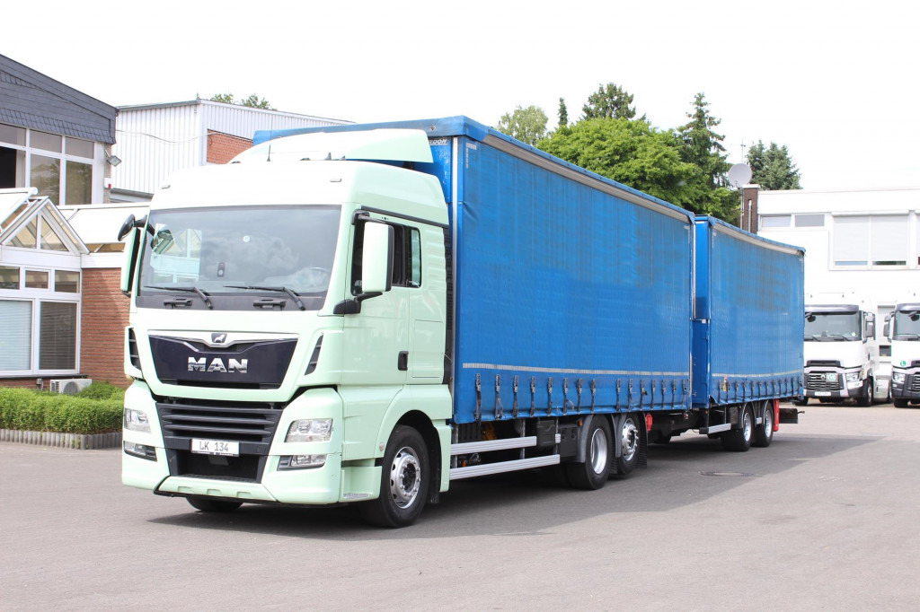 MAN TGX 26.460 Retarder Jumbo-Zug 120M3 Durchlade - Camion à rideaux coulissants: photos 1 MAN TGX 26.460 Retarder Jumbo-Zug 120M3 Durchlade - Camion à rideaux coulissants: photos 1
