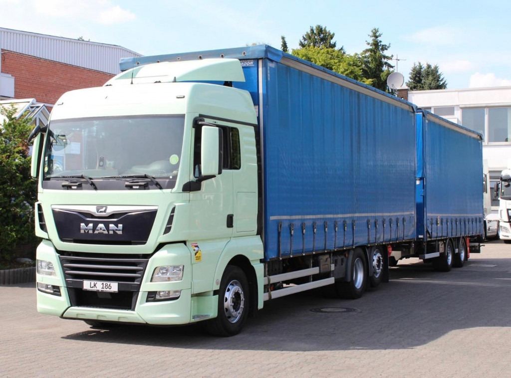 MAN TGX 26.460 Retarder Jumbo-Zug 120M3 Durchlade - Camion à rideaux coulissants: photos 1 MAN TGX 26.460 Retarder Jumbo-Zug 120M3 Durchlade - Camion à rideaux coulissants: photos 1