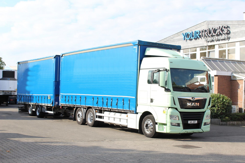 MAN TGX 26.460 Retarder Jumbo-Zug 120M3 Durchlade - Camion à rideaux coulissants: photos 1 MAN TGX 26.460 Retarder Jumbo-Zug 120M3 Durchlade - Camion à rideaux coulissants: photos 1
