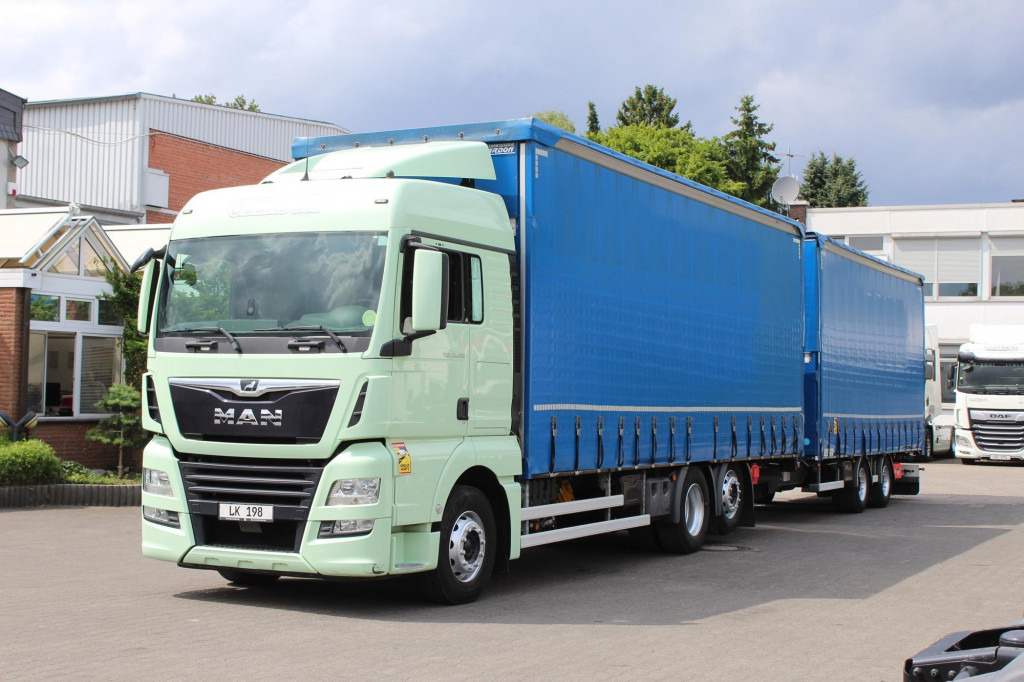 MAN TGX 26.460 Retarder Jumbo-Zug 120M3 Durchlade - Camion à rideaux coulissants: photos 1 MAN TGX 26.460 Retarder Jumbo-Zug 120M3 Durchlade - Camion à rideaux coulissants: photos 1