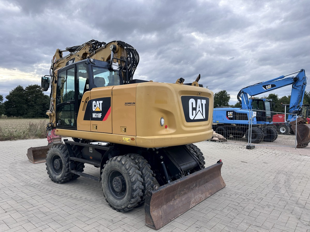 CATERPILLAR M 318 F Offset boom Deutsche Maschine Top ! - Pelle sur pneus: photos 5 CATERPILLAR M 318 F Offset boom Deutsche Maschine Top ! - Pelle sur pneus: photos 5