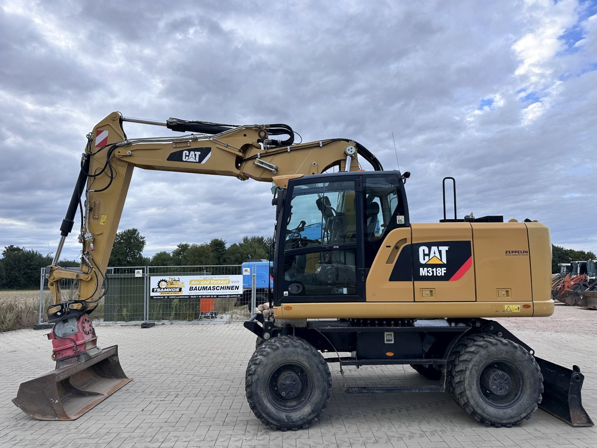 CATERPILLAR M 318 F Offset boom Deutsche Maschine Top ! - Pelle sur pneus: photos 1 CATERPILLAR M 318 F Offset boom Deutsche Maschine Top ! - Pelle sur pneus: photos 1