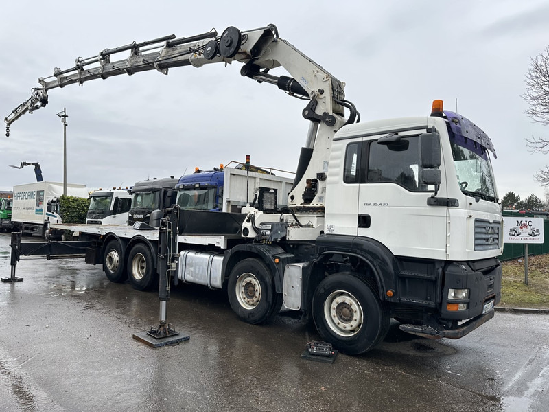 MAN TGA 35.430 8x2 + KRAN HIAB 700 E-6 + JIB 165X-3 - RETARDER - PRITSCHE 6m70~8m50 EXTENDABLE - MANUAL GEARBOX ZF - LIFT + STEERING AXLE - Camion plateau, Camion grue: photos 1 MAN TGA 35.430 8x2 + KRAN HIAB 700 E-6 + JIB 165X-3 - RETARDER - PRITSCHE 6m70~8m50 EXTENDABLE - MANUAL GEARBOX ZF - LIFT + STEERING AXLE - Camion plateau, Camion grue: photos 1