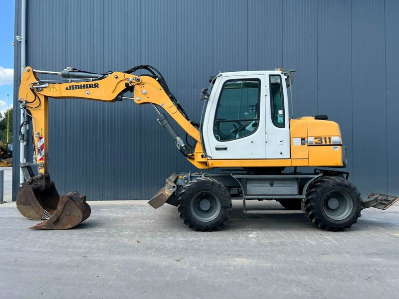 Liebherr A311 Litronic - Pelle sur pneus: photos 5 Liebherr A311 Litronic - Pelle sur pneus: photos 5