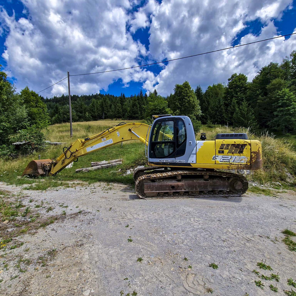 New Holland Kobelco E215 - Pelle sur chenille: photos 1 New Holland Kobelco E215 - Pelle sur chenille: photos 1