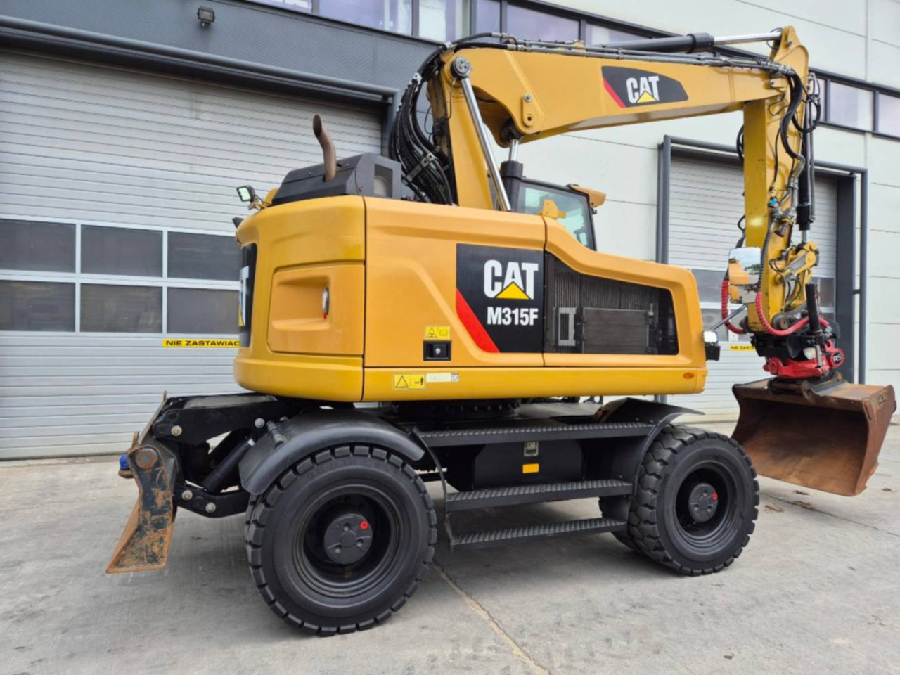 CAT M315F - Pelle sur pneus: photos 3 CAT M315F - Pelle sur pneus: photos 3