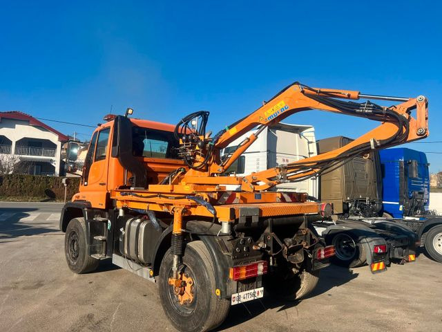 Unimog U500 4x4, Boeschungsmaehwerk Mulag - Camion: photos 1 Unimog U500 4x4, Boeschungsmaehwerk Mulag - Camion: photos 1