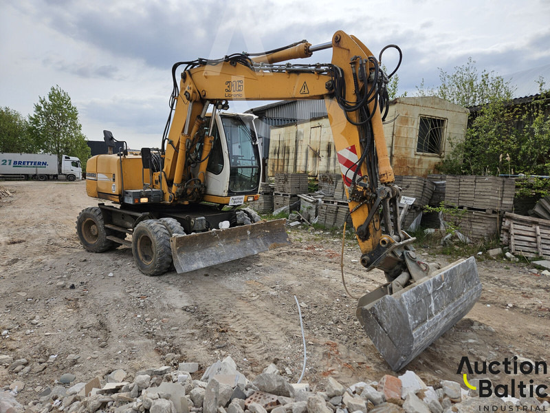 Liebherr A 316 Litronic - Pelle sur pneus: photos 2 Liebherr A 316 Litronic - Pelle sur pneus: photos 2