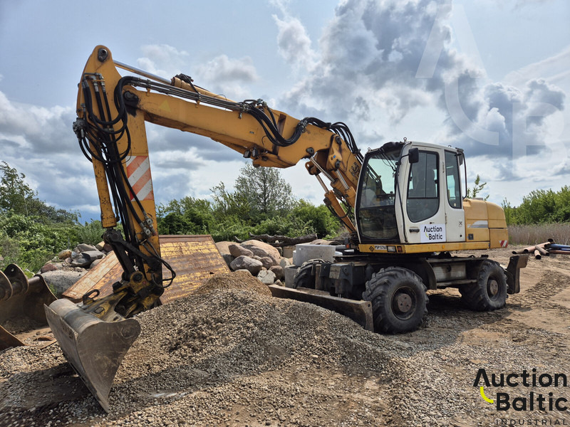 Liebherr A 316 Litronic - Pelle sur pneus: photos 1 Liebherr A 316 Litronic - Pelle sur pneus: photos 1