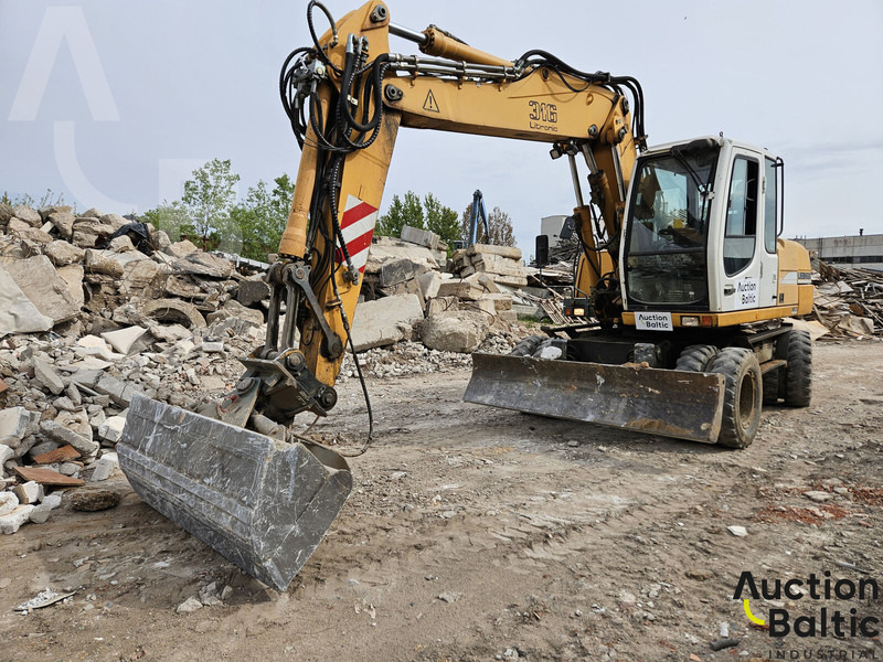 Liebherr A 316 Litronic - Pelle sur pneus: photos 1 Liebherr A 316 Litronic - Pelle sur pneus: photos 1