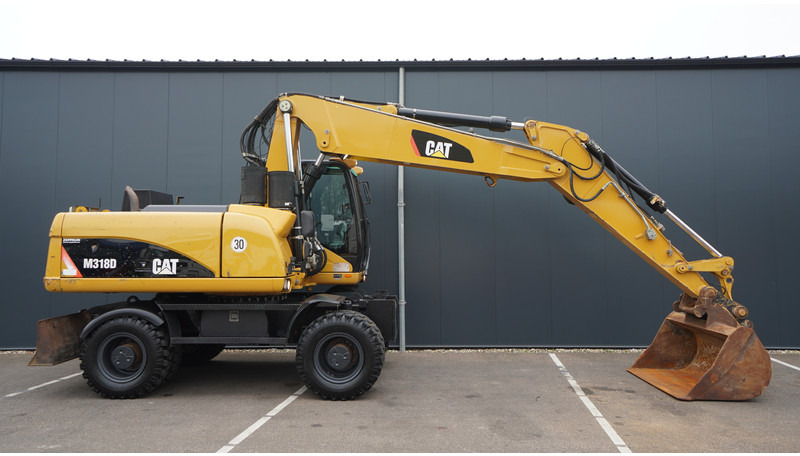 Caterpillar M318D 4X4 WHEELED EXCAVATOR - Engins de chantier: photos 2 Caterpillar M318D 4X4 WHEELED EXCAVATOR - Engins de chantier: photos 2