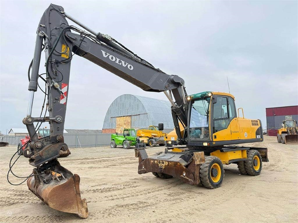 Volvo EW 230 C, 25 ton - Pelle sur pneus: photos 1 Volvo EW 230 C, 25 ton - Pelle sur pneus: photos 1
