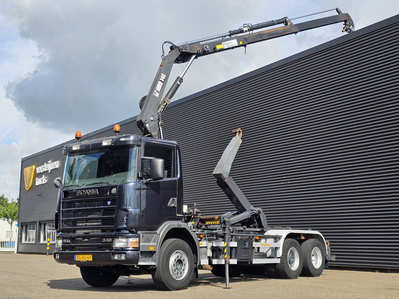 Scania R114.340 6x2 / HIAB CRANE + 25T HOOKLIFT - Camion ampliroll, Camion grue: photos 1 Scania R114.340 6x2 / HIAB CRANE + 25T HOOKLIFT - Camion ampliroll, Camion grue: photos 1