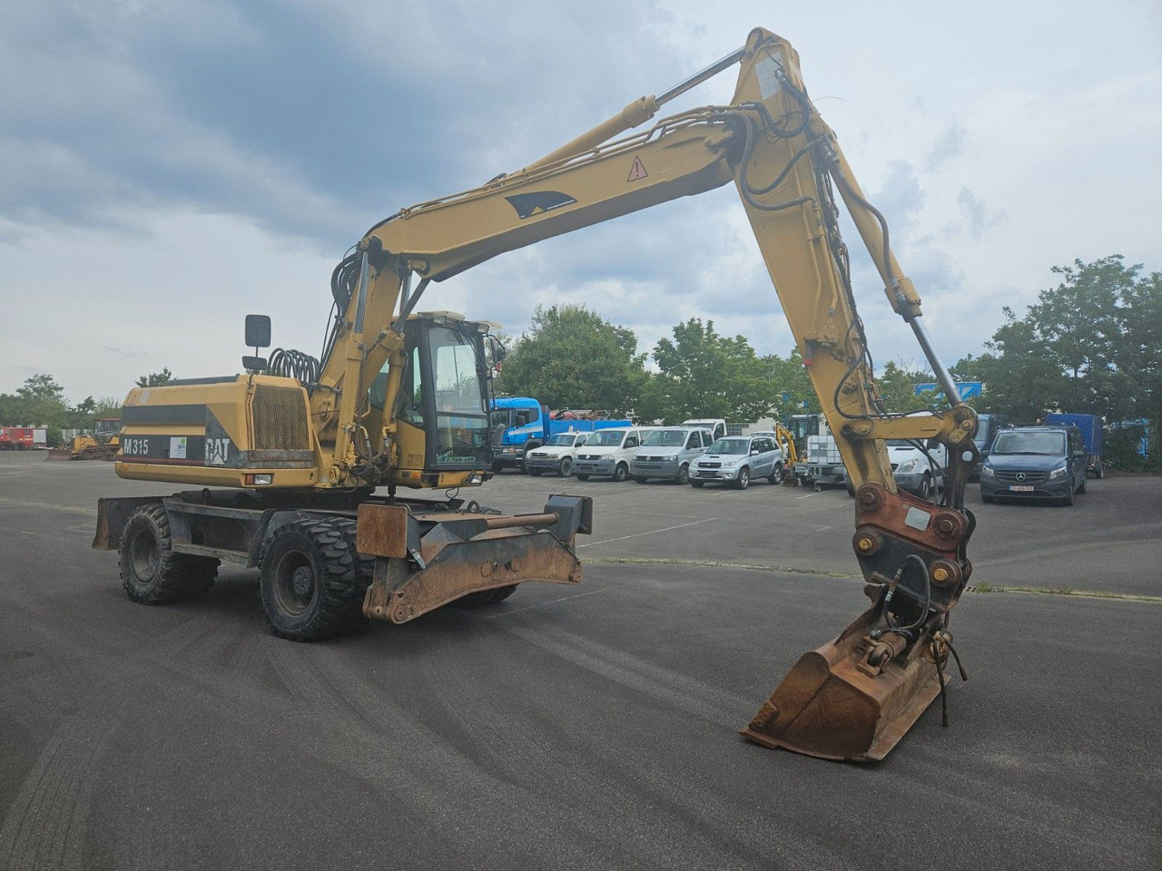 CAT M315 Mobilbagger mit Pratzen und Schild - Pelle sur pneus: photos 4 CAT M315 Mobilbagger mit Pratzen und Schild - Pelle sur pneus: photos 4