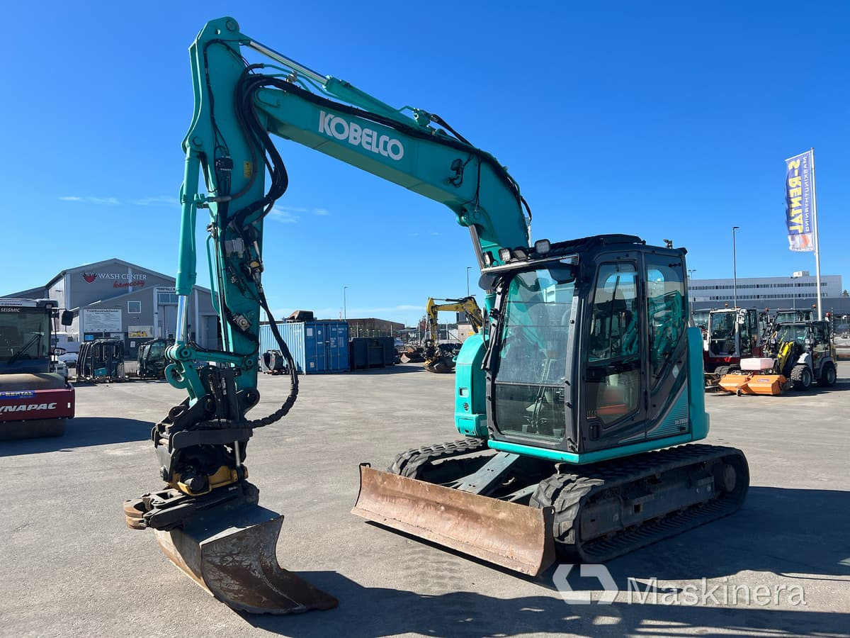 Grävmaskin Kobelco SK75SR-3E - Pelle sur chenille: photos 1 Grävmaskin Kobelco SK75SR-3E - Pelle sur chenille: photos 1