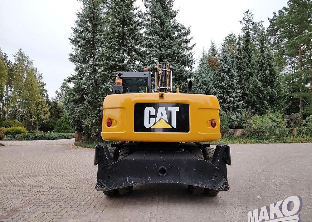 Caterpillar M313D - Pelle sur pneus: photos 3 Caterpillar M313D - Pelle sur pneus: photos 3