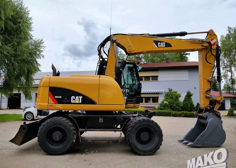 Caterpillar M313D - Pelle sur pneus: photos 5 Caterpillar M313D - Pelle sur pneus: photos 5