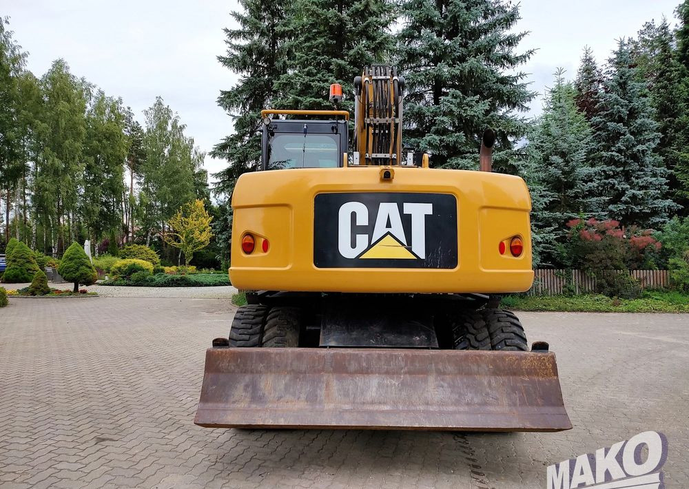 Caterpillar M313D - Pelle sur pneus: photos 3 Caterpillar M313D - Pelle sur pneus: photos 3