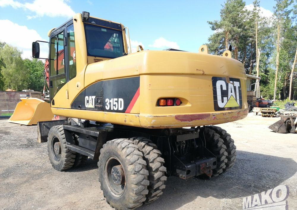 Caterpillar M315 C - Pelle sur pneus: photos 3 Caterpillar M315 C - Pelle sur pneus: photos 3