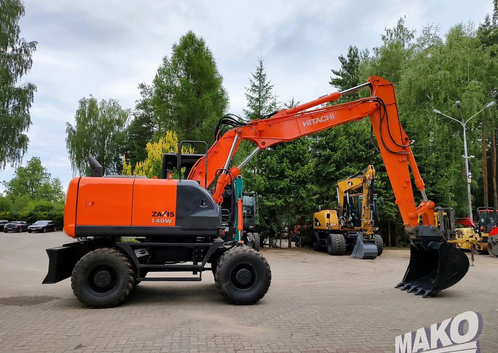 Hitachi ZX 140 - Pelle sur pneus: photos 5 Hitachi ZX 140 - Pelle sur pneus: photos 5