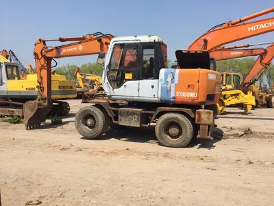 Original Color Tire Excavator Hitachi Ex100wd Ex160wd Moving by Wheels - Pelle sur chenille: photos 1 Original Color Tire Excavator Hitachi Ex100wd Ex160wd Moving by Wheels - Pelle sur chenille: photos 1