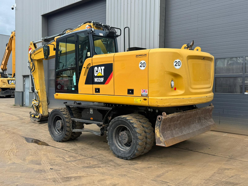 Caterpillar M320F - Pelle sur pneus: photos 3 Caterpillar M320F - Pelle sur pneus: photos 3