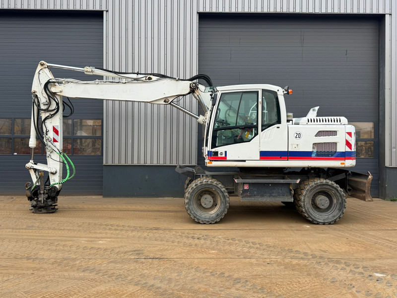Volvo EW160D - Pelle sur pneus: photos 1 Volvo EW160D - Pelle sur pneus: photos 1