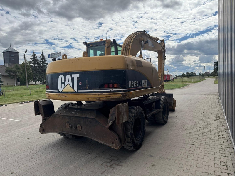 Caterpillar M 315 C - Pelle sur pneus: photos 3 Caterpillar M 315 C - Pelle sur pneus: photos 3