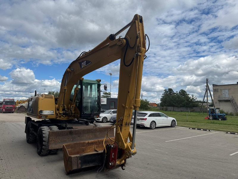 Caterpillar M 315 C - Pelle sur pneus: photos 2 Caterpillar M 315 C - Pelle sur pneus: photos 2
