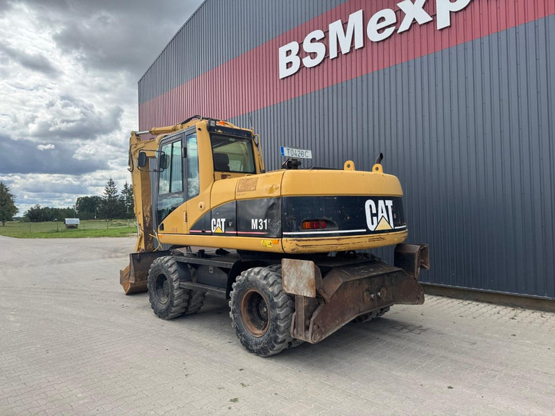Caterpillar M 315 C - Pelle sur pneus: photos 4 Caterpillar M 315 C - Pelle sur pneus: photos 4