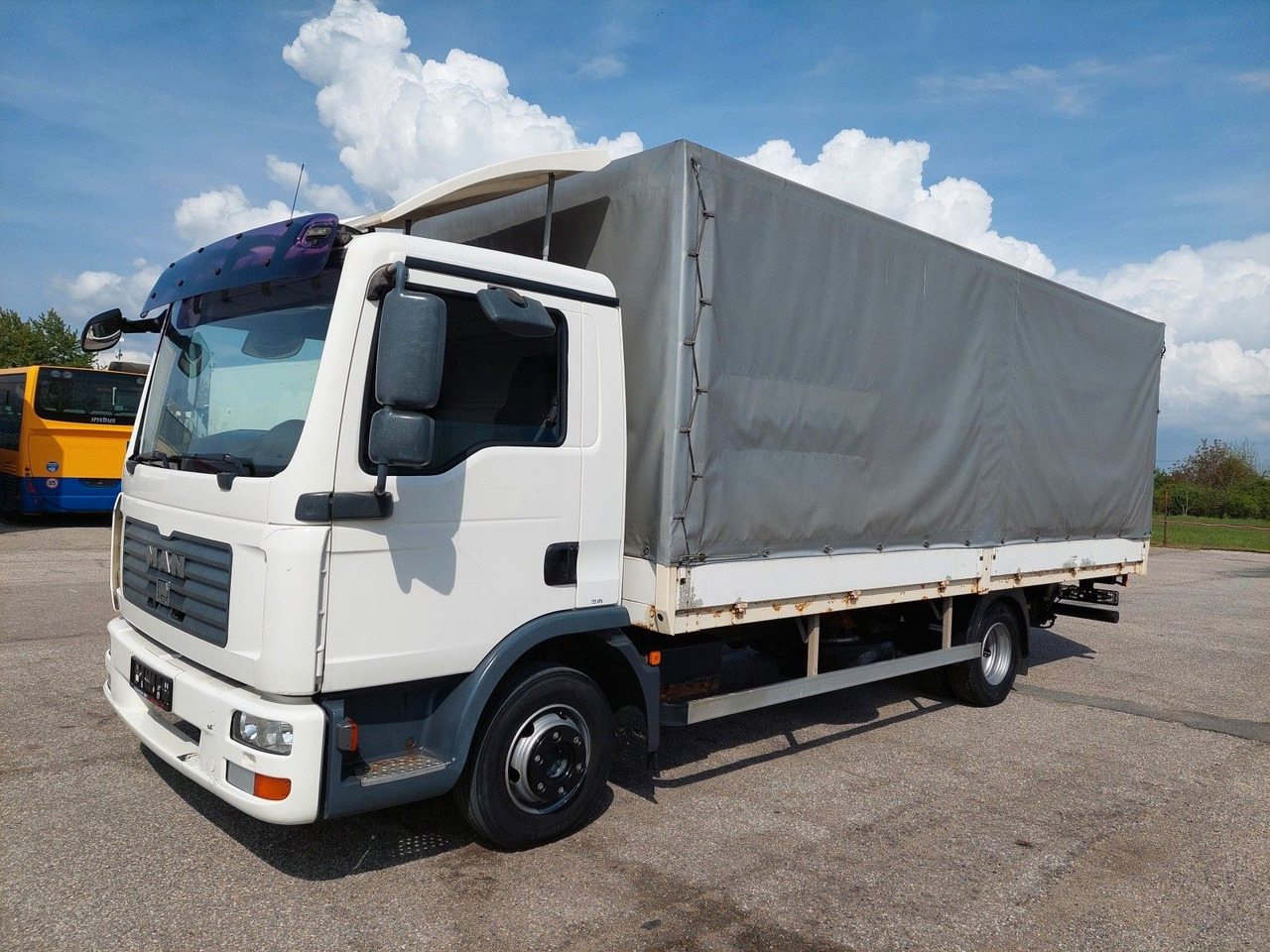 MAN TGL 8.180 4X2 BL - Camion à rideaux coulissants: photos 1 MAN TGL 8.180 4X2 BL - Camion à rideaux coulissants: photos 1