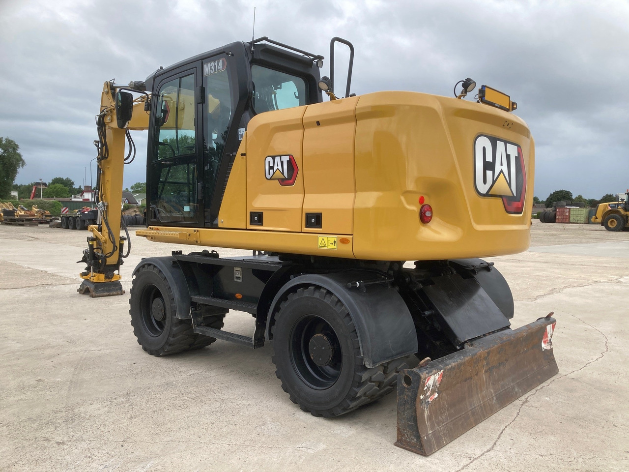CATERPILLAR M314 - Pelle sur pneus: photos 1 CATERPILLAR M314 - Pelle sur pneus: photos 1
