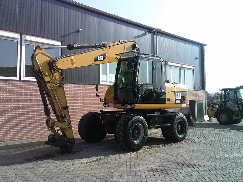 Caterpillar M315D - Pelle sur pneus: photos 1 Caterpillar M315D - Pelle sur pneus: photos 1