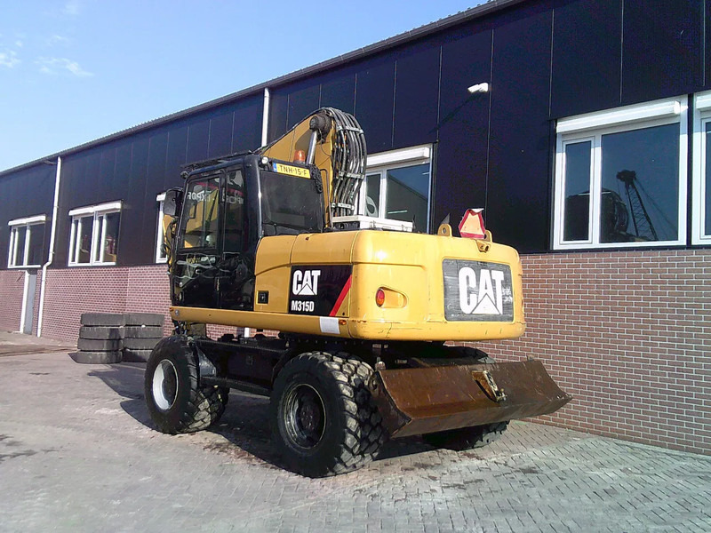 Caterpillar M315D - Pelle sur pneus: photos 2 Caterpillar M315D - Pelle sur pneus: photos 2