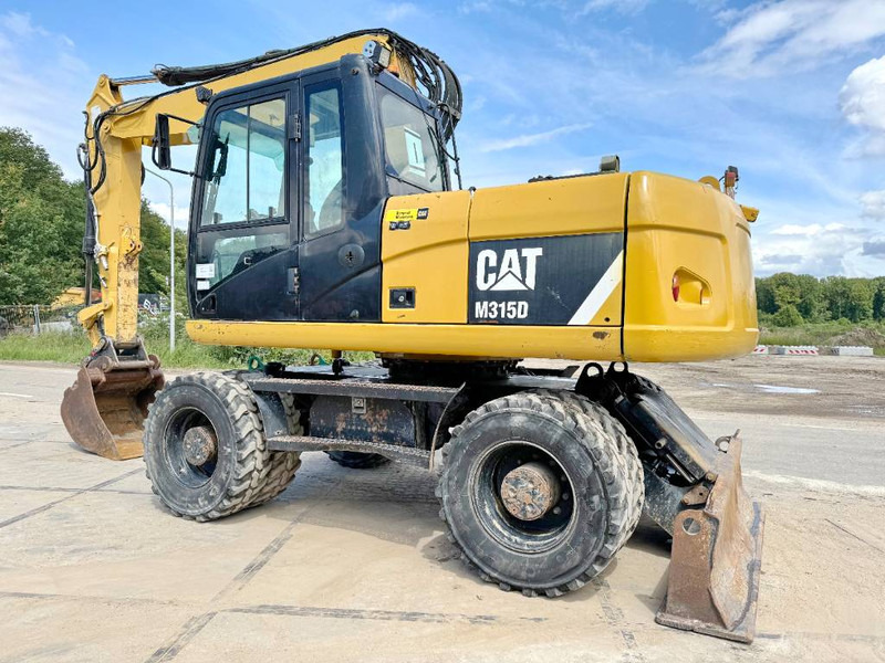 Cat M315D - Triple Boom / Quick Coupler - Pelle sur pneus: photos 3 Cat M315D - Triple Boom / Quick Coupler - Pelle sur pneus: photos 3