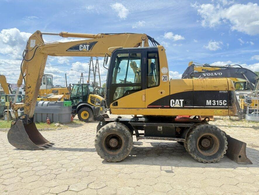 CAT M315C AC - Pelle sur pneus: photos 1 CAT M315C AC - Pelle sur pneus: photos 1