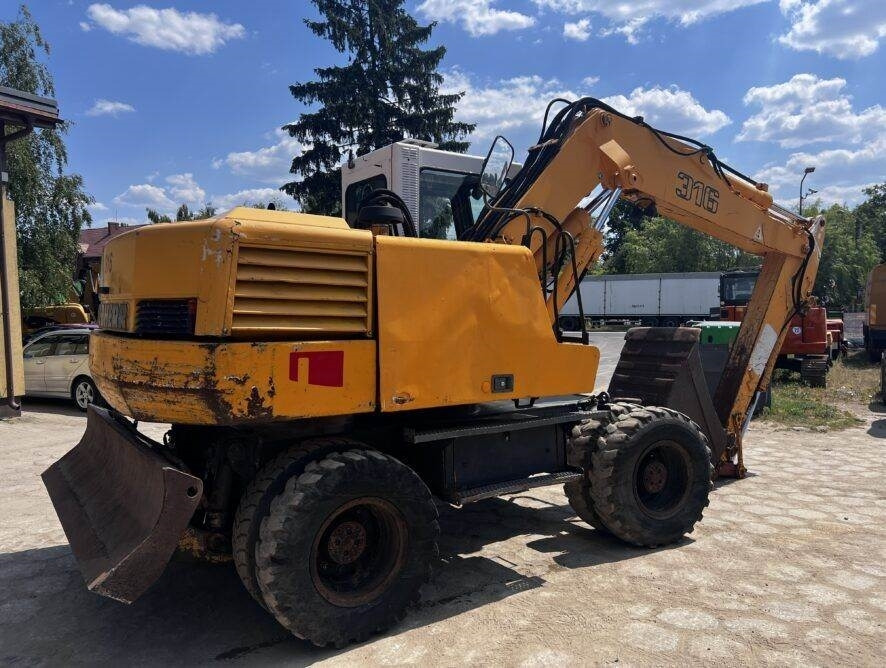 Liebherr A316 - Pelle sur pneus: photos 5 Liebherr A316 - Pelle sur pneus: photos 5