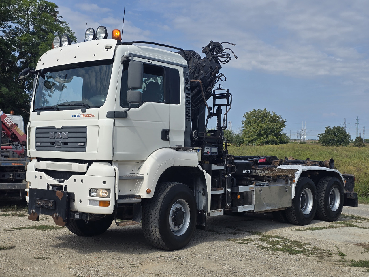 MAN TGA 26.440 6X6 / HOOK SYSTEM / HIAB 166D REMOTE SPECIAL PRICE ONLY THIS YEAR - Camion ampliroll, Camion grue: photos 1 MAN TGA 26.440 6X6 / HOOK SYSTEM / HIAB 166D REMOTE SPECIAL PRICE ONLY THIS YEAR - Camion ampliroll, Camion grue: photos 1